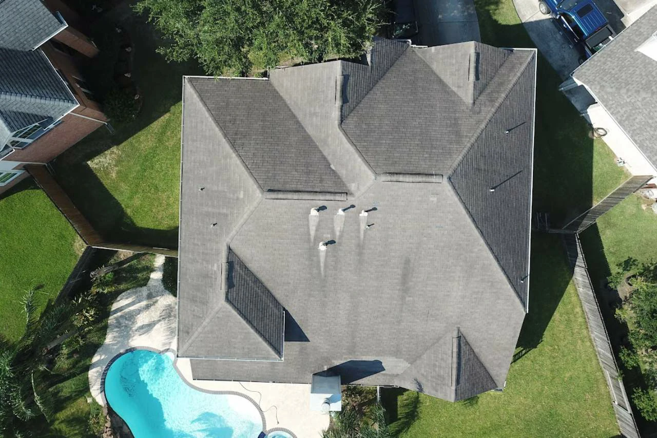 Licensed drone pilot operating controller during drone roof inspections by Achilles Roofing & Exterior