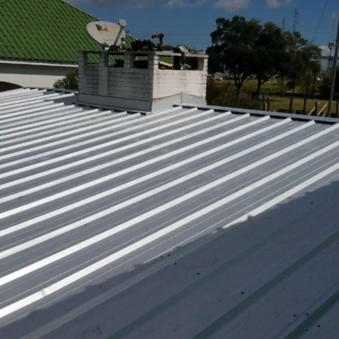Installed R panel metal roofing system on a commercial building roof deck by Achilles Roofing & Exterior