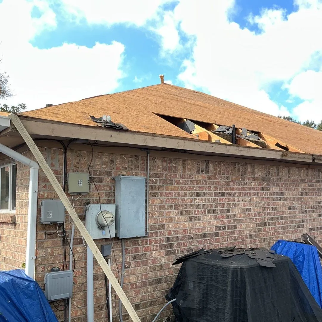 Roof replacement in progress on a single-story home financed through GreenSky financing by Achilles Roofing & Exterior