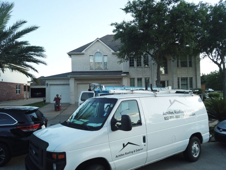 Achilles Roofing & Exterior service vehicle in front of a finished roofing project, representing trusted craftsmanship and professional service of a trusted roofing company.