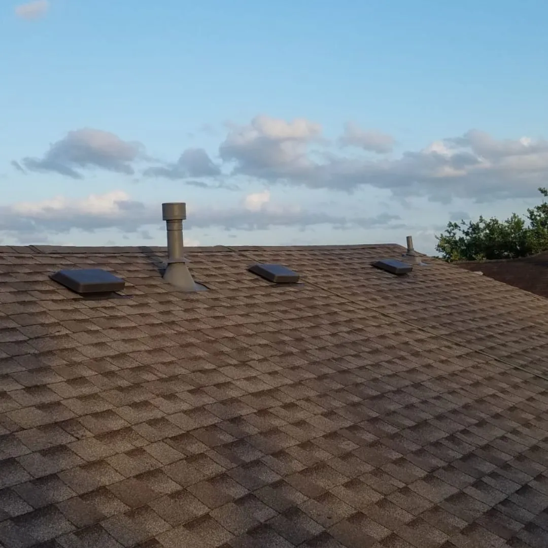 Residential asphalt shingle roof with skylights inspected for asphalt shingle repair by Achilles Roofing & Exterior