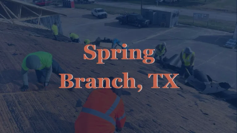 This image shows a roofer removing old asphalt shingles from the roof of a home in Spring Branch, TX, exposing the wood decking beneath in preparation for replacement.