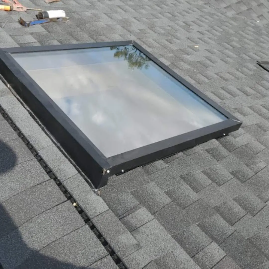 Installed rectangular roof skylight with watertight flashing prepped during a skylight installation by Achilles Roofing & Exterior