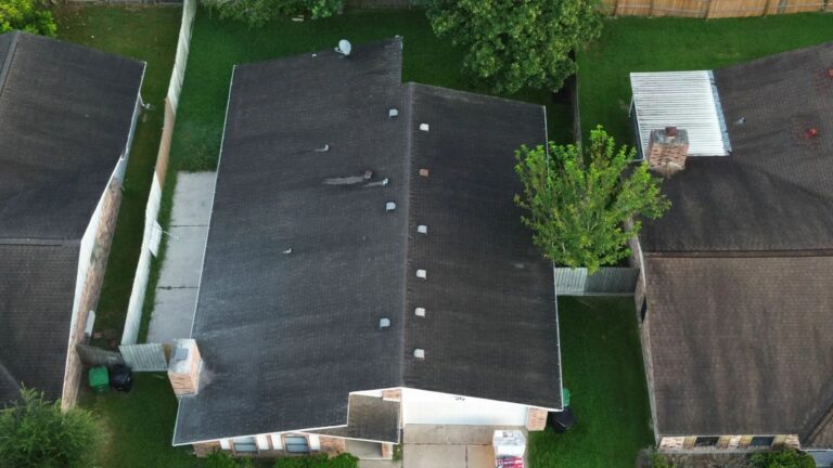 Best Roof Installation. An overhead drone shot showing a typical residential roof structure. This visual is used to connect with homeowners who are beginning to consider a full replacement or new construction. It positions the company as the provider of the best roof installation by emphasizing quality and long-lasting results for standard residential properties.