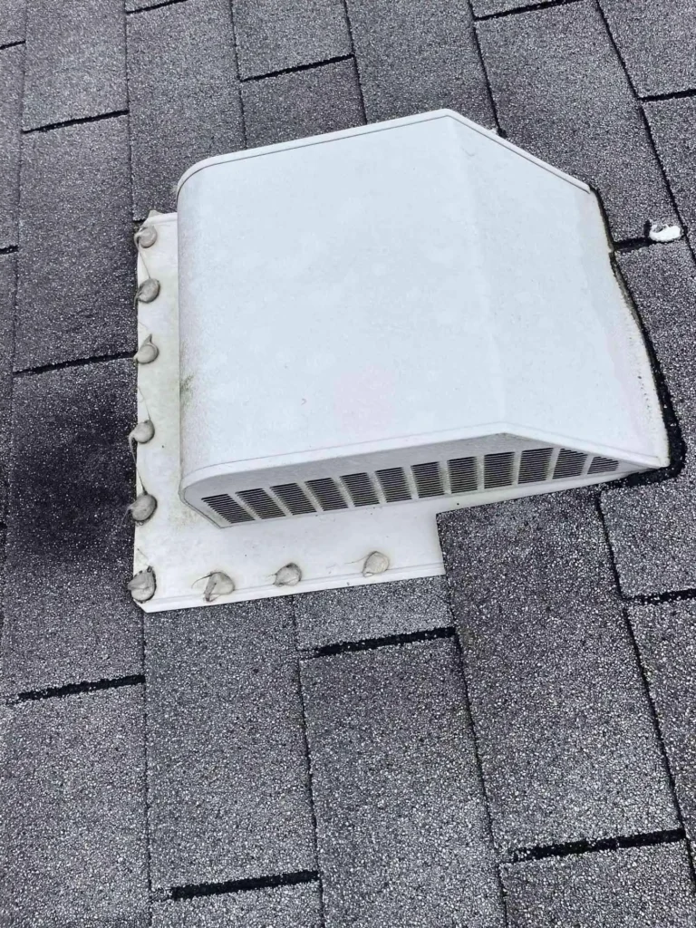 This image shows a completed roof replacement on a Baytown, TX home — newly installed shingles appear uniform, with ventilation vents freshly fitted and sealed.