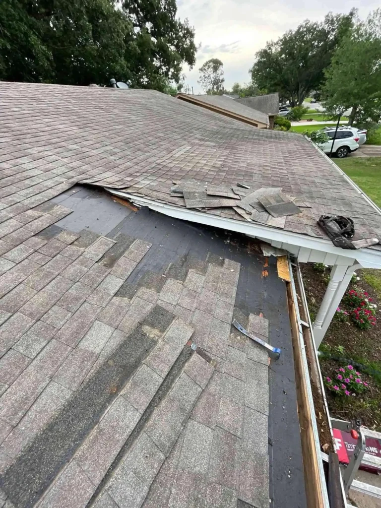 This picture highlights a roof area where shingles are absent and decking is visible, evidencing the condition before the Roof Repair work started in Houston, TX.