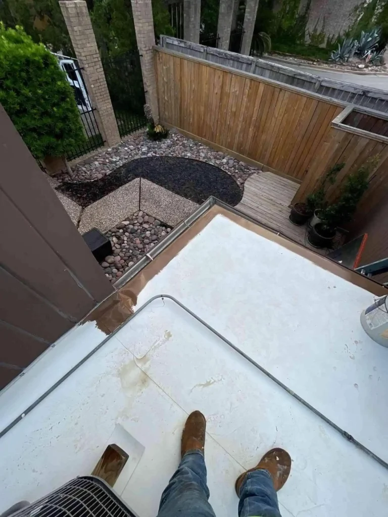 In this image, the rooftop surface appears smooth and uniform after retrofit, with no signs of damage or ponding, highlighting the quality of the completed flat roofing project.