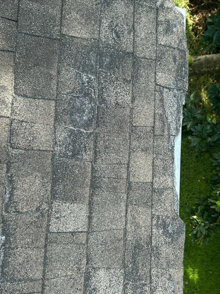 This image shows before image of worn shingles and weathered roof deck, Houston TX