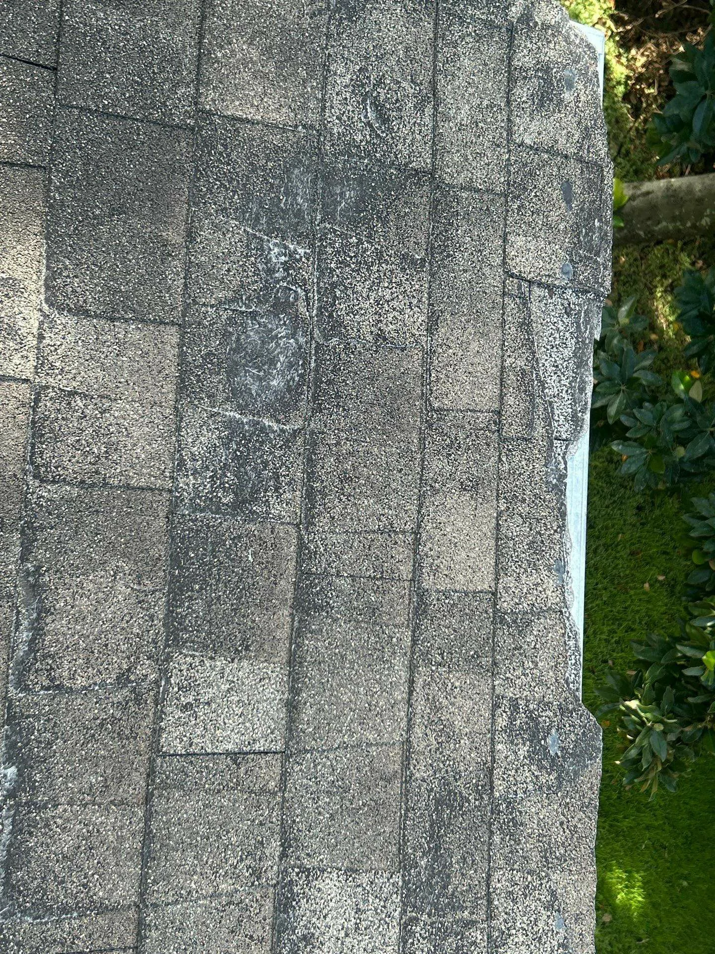 This image shows before image of worn shingles and weathered roof deck, Houston TX