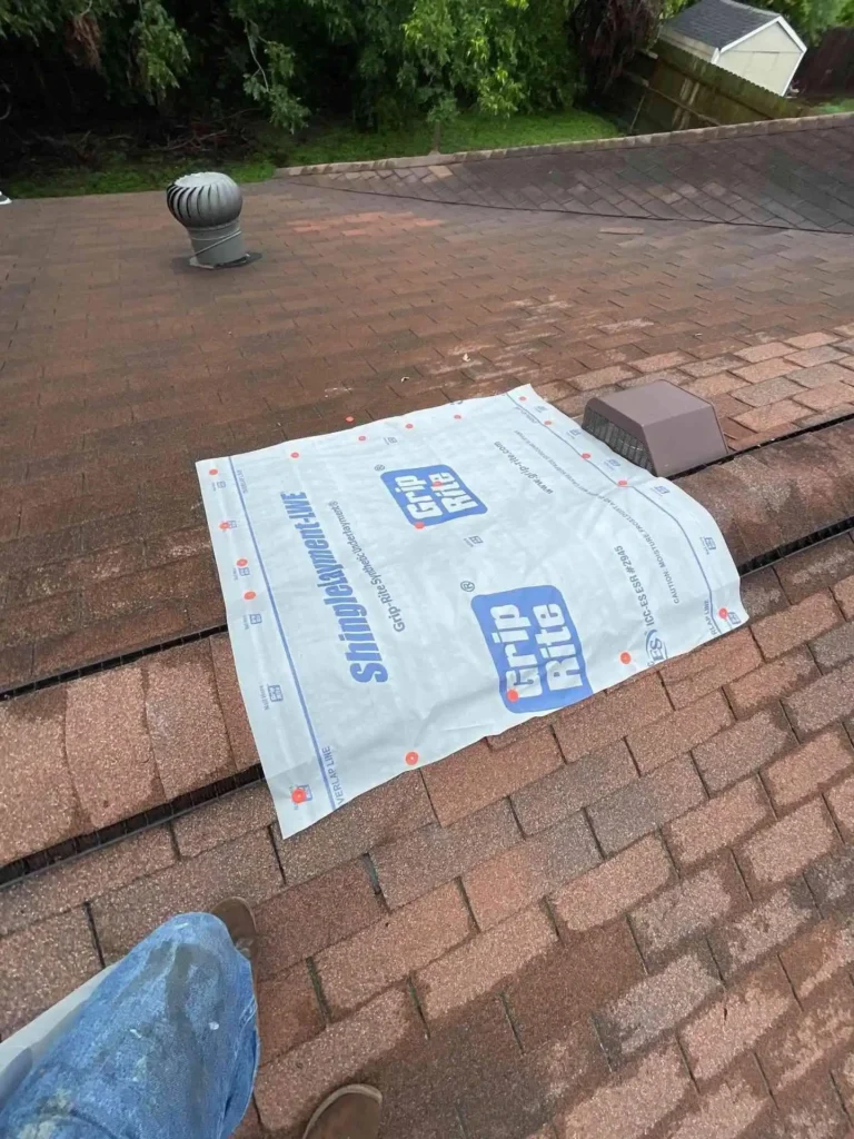 This image shows the completed Emergency Tarp Installation after project completion — tarps set firmly across all exposed areas on this Houston, TX roof.