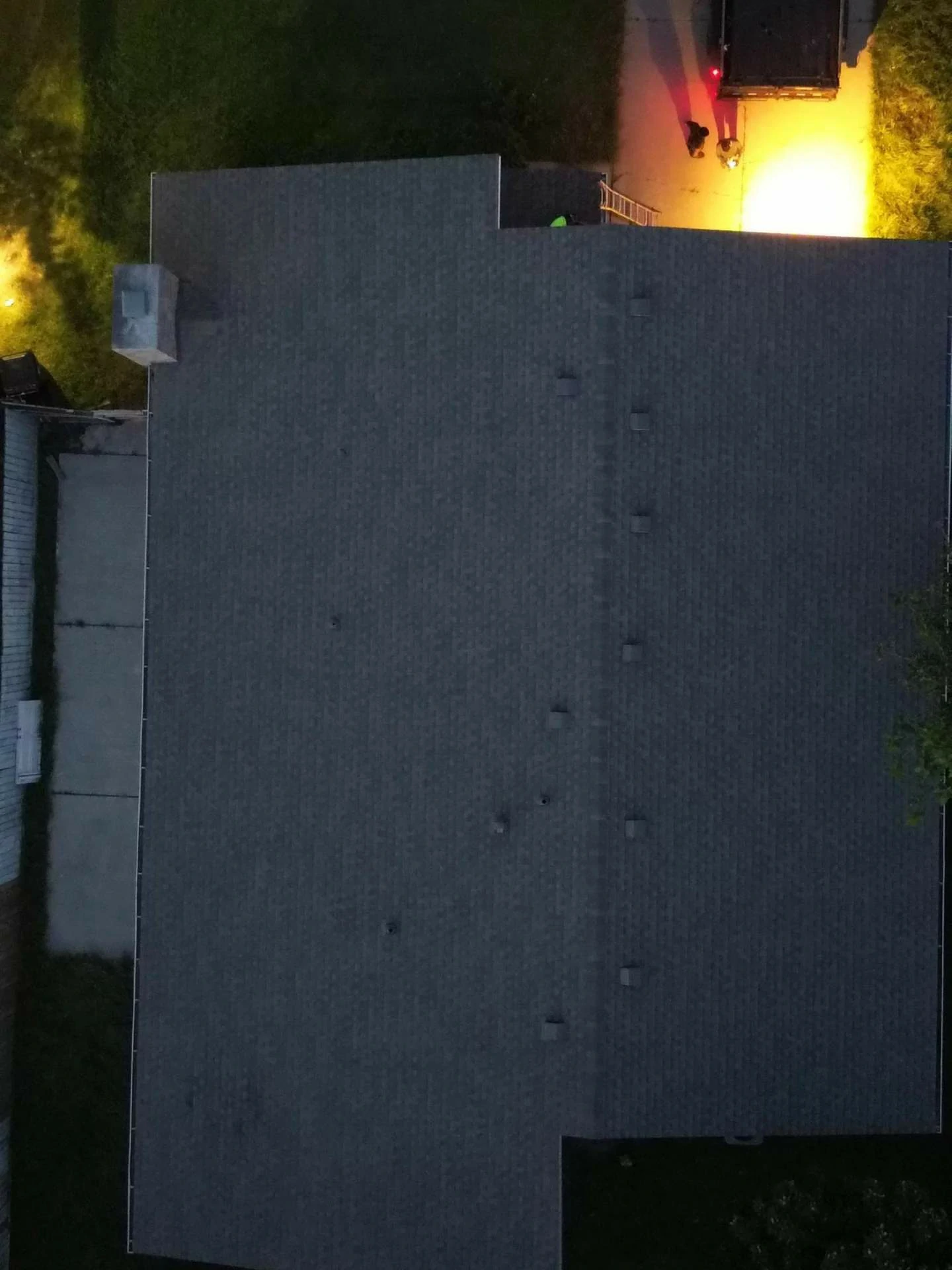 This image shows a freshly replaced roof on a Houston, TX residence — new shingles lay flat and uniform across the entire roof surface, reflecting recent installation.
