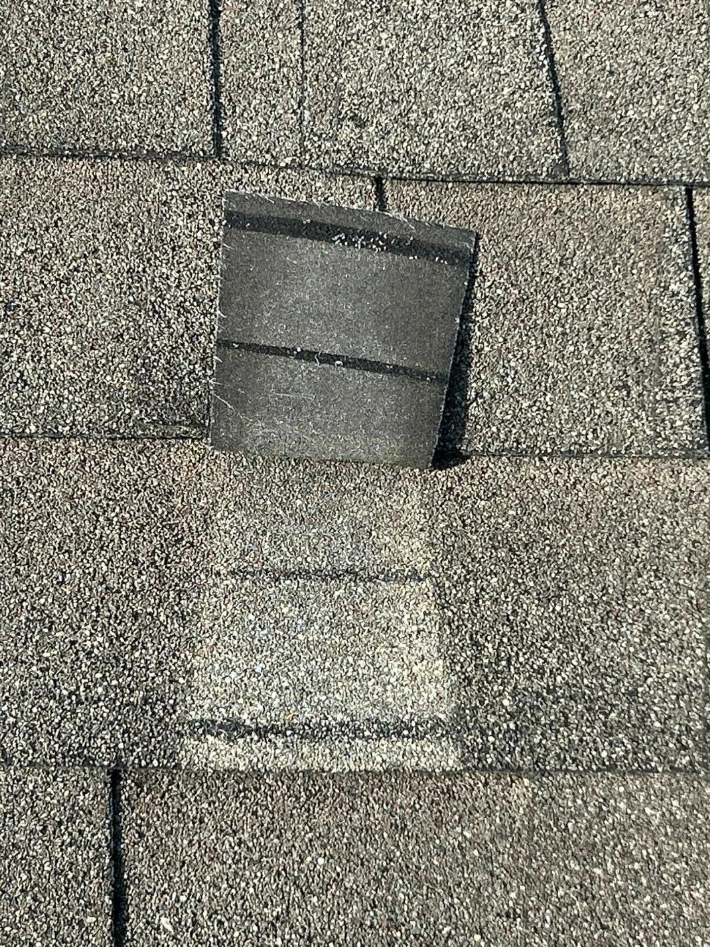 This image shows the original roof on a Houston, TX home, with damaged and missing shingles — highlighting why a full roof replacement was necessary.