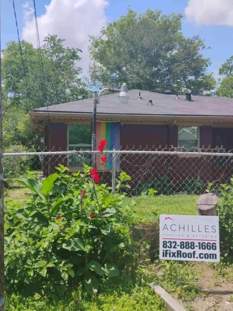 This image shows a Houston, TX home after roof replacement, with freshly installed asphalt shingles covering the entire roof — the new roof system gives a neat, uniform appearance.