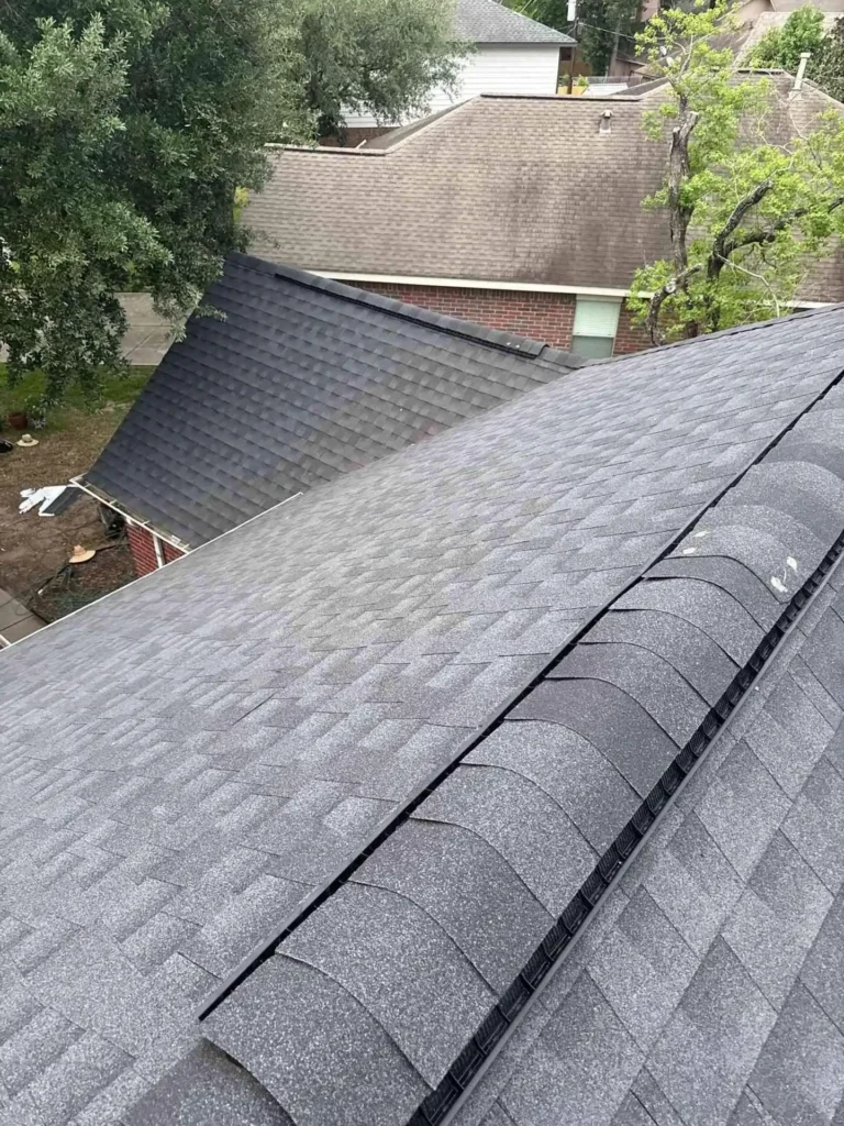 This image shows the newly installed shingles on a Houston, TX home roof right after replacement — the surface appears even, clean, and free of old wear.