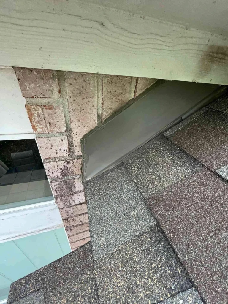 This image shows a freshly replaced roof on a Houston, TX residence — new shingles lay flat and uniform across the entire roof surface, reflecting recent installation.