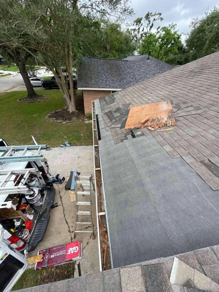 In this image you can see a larger portion of the roof with missing shingles on a residential property in Houston, TX, taken during the pre-repair assessment.