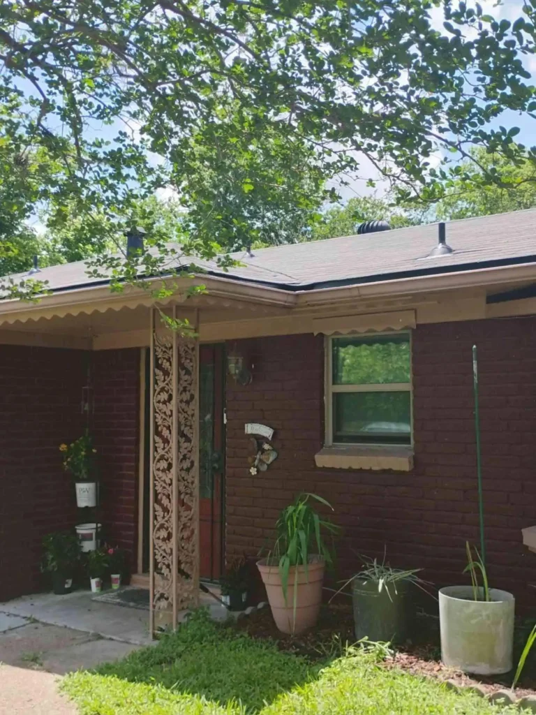 This image shows a freshly replaced roof on a Houston, TX home with new shingles neatly aligned and roof edges clean after roof replacement.