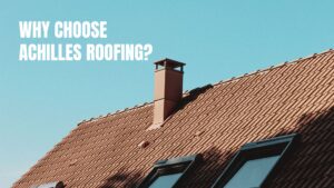 A professionally installed clay tile roofing system on a house featuring a chimney and skylights against a clear blue sky.