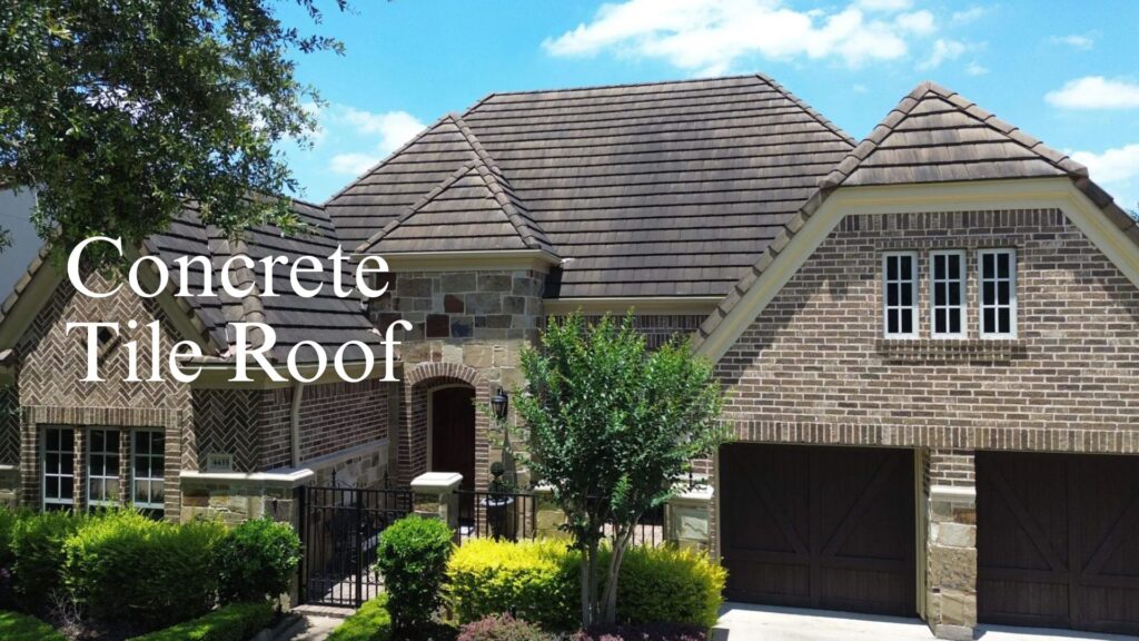 A luxurious multi-gabled brick home showcasing a durable brown concrete tile roof installation.