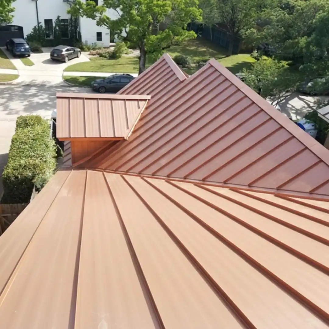 Standing seam copper metal roofing installed on a luxury residential home as part of a premium roofing system by Achilles Roofing & Exterior