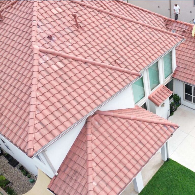 Multi-gable residential home with red Spanish clay tile premium roofing system installed by Achilles Roofing & Exterior